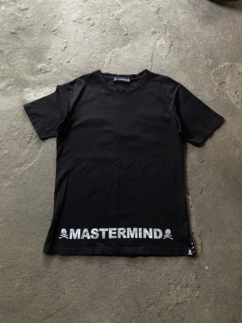 Mastermind World Black T-Shirt with Back Logo (Category: Tshirts & Polo Shirts ) located in Caloocan City. Submitted by remythrift (Listing ID 1470187400, Image 1). Description: - Brand: Mastermind World - Color: Classic Black - Fit: Regular fit crew neck - Back Design: Large silver circular logo with iconic skull and crossbones - Front Detail: Bold mastermind branding flanked by skulls on the front hem - Finishing Touches: Small woven skull labe