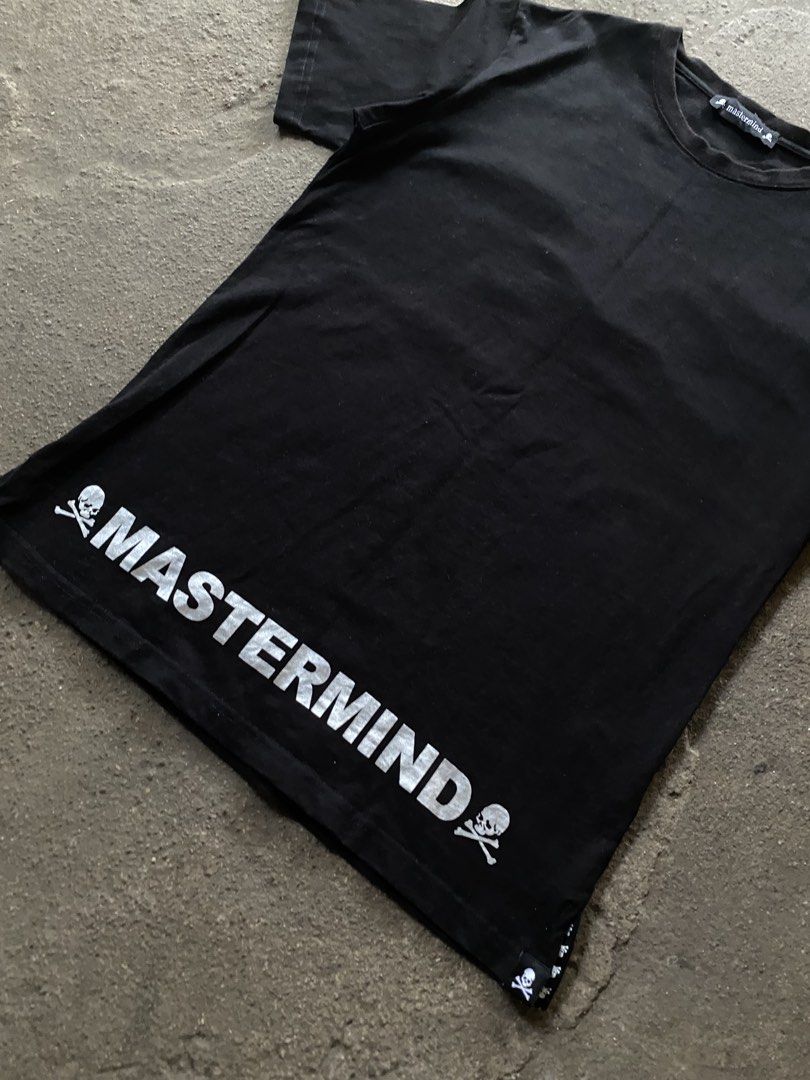 Mastermind World Black T-Shirt with Back Logo (Category: Tshirts & Polo Shirts ) located in Caloocan City. Submitted by remythrift (Listing ID 1470187400, Image 3). Description: - Brand: Mastermind World - Color: Classic Black - Fit: Regular fit crew neck - Back Design: Large silver circular logo with iconic skull and crossbones - Front Detail: Bold mastermind branding flanked by skulls on the front hem - Finishing Touches: Small woven skull labe