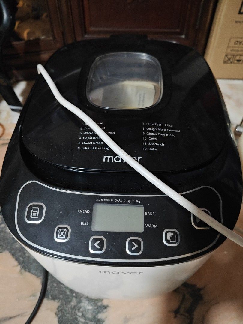 Mayer Bread Maker Machine (Category: Breadmakers) located in Singapore. Submitted by hojianhao.1 (Listing ID 1470263972, Image 1). Description: - Brand/Model: Mayer Bread Maker (White & Black) - Condition: Powers up fine, fully functional - Features: Digital control panel with 11 versatile modes (Basic, French, Gluten Free, Dough, Cake, Bake & more) - Design: Convenient top viewing window - Included: White power cord - Perfect for: Making fresh, 
