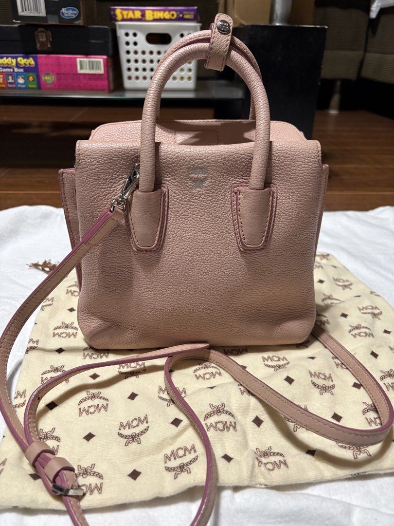 MCM Pink Leather (Mini Milla Bag) (Category: Luxury Bags & Wallets) located in Bulacan. Submitted by love2loved (Listing ID 1470279608, Image 2). Description: - Am pink pebbled leather bag from MCM - Dual top handles and a detachable shoulder strap for versatile carrying - Sleek silver-tone hardware with a subtle MCM logo stamped on the front Good condition Signs of wear/used Size : small Rubber lining intact Wala bak bak or butas Flaws: wala yun