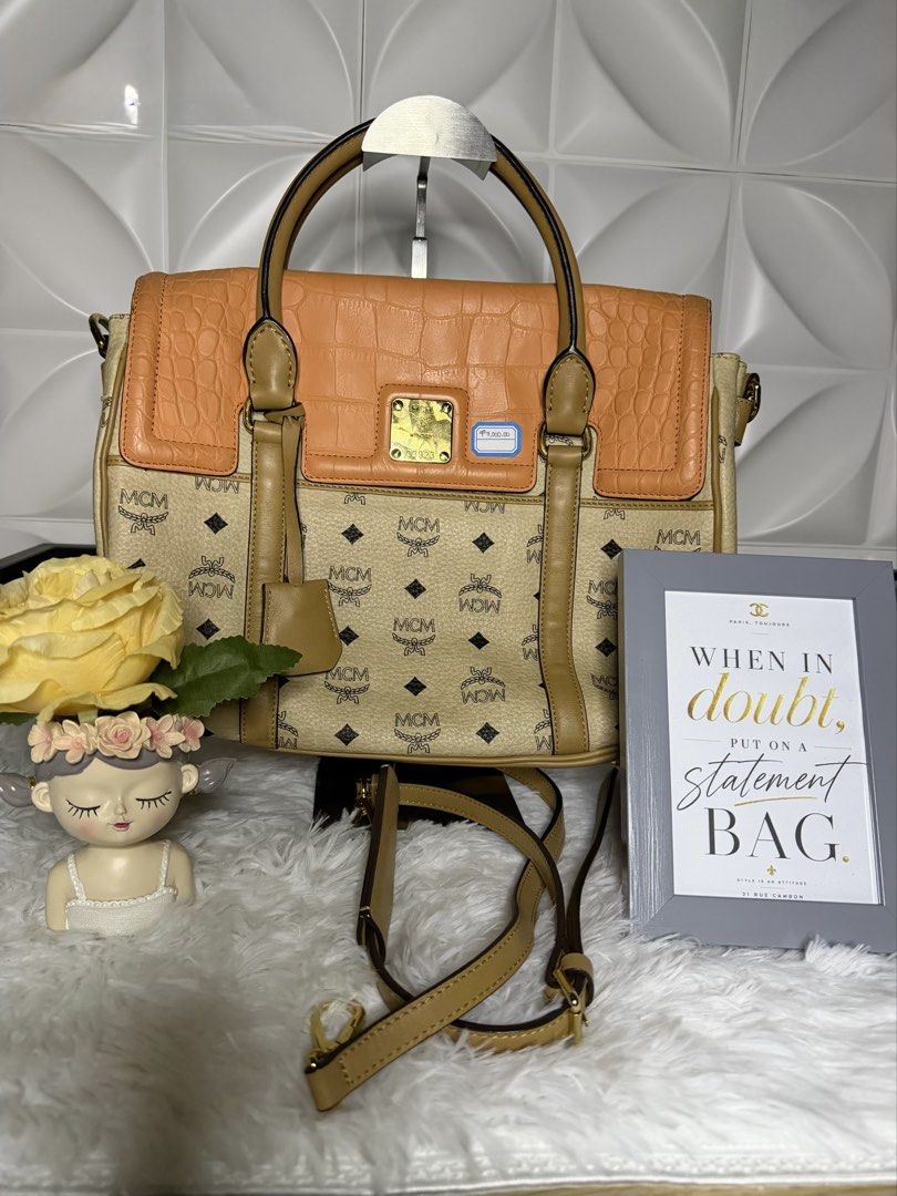 MCM Visetos Monogram Crocodile Embossed Flap Satchel Bag (Category: Luxury Bags & Wallets) located in Bulacan. Submitted by the_chanel-hermes__enthusiast (Listing ID 1470307696, Image 1). Description: - Brand: MCM - Material: Monogram canvas with brown leather trim - Flap Detail: Orange crocodile-embossed leather with front plaque closure - Hardware: Gold-tone - Condition: Like new - Included: Dual top handles and adjustable shoulder strap - Desi