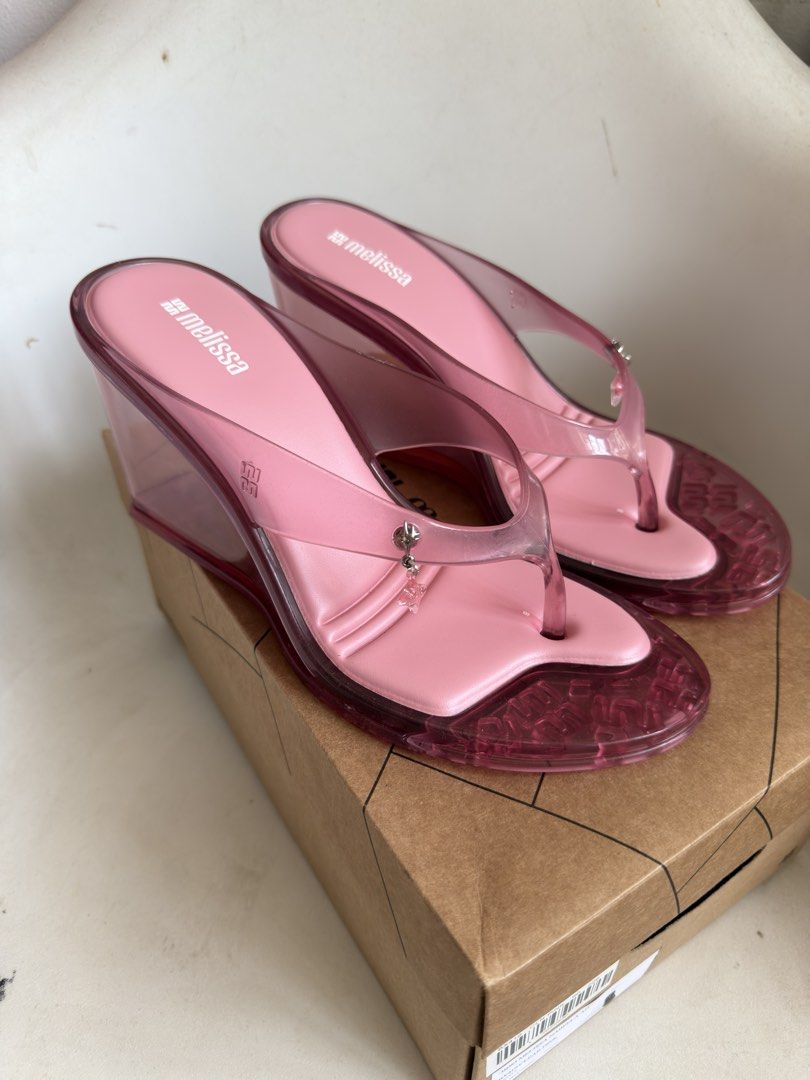 Melissa Nabeela Clear Pink Wedges (Category: Flats & Sandals) located in Quezon City. Submitted by socutexx (Listing ID 1470206674, Image 1). Description: NEW Melissa Nabeela - Style: Thong wedge sandals with chunky translucent heel - Color: Clear Pink - Size: 9 US - Inclusion: Original shoe box included - Condition: Excellent/NEW RFS: too many shoes.
