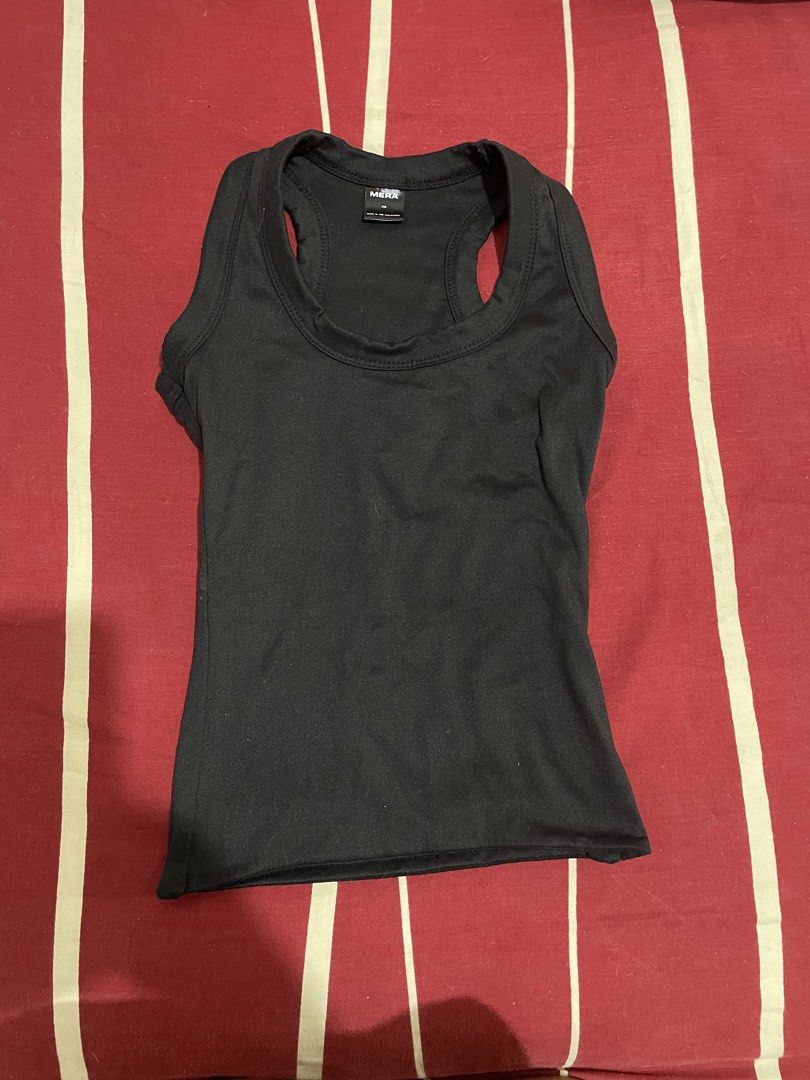 MERA Black Racerback Tank Top Size XS (Category: Sleeveless) located in Manila. Submitted by alysaysyys_ (Listing ID 1470174077, Image 1). Description: - Brand: MERA - Size: XS - Color: Black - Style: Racerback tank top with scoop neckline and fitted cut - Material: Lightweight, stretchable fabric - Condition: Clean, smoke-free home - Perfect for daily wear and easy to pair with jeans, shorts, or skirts.