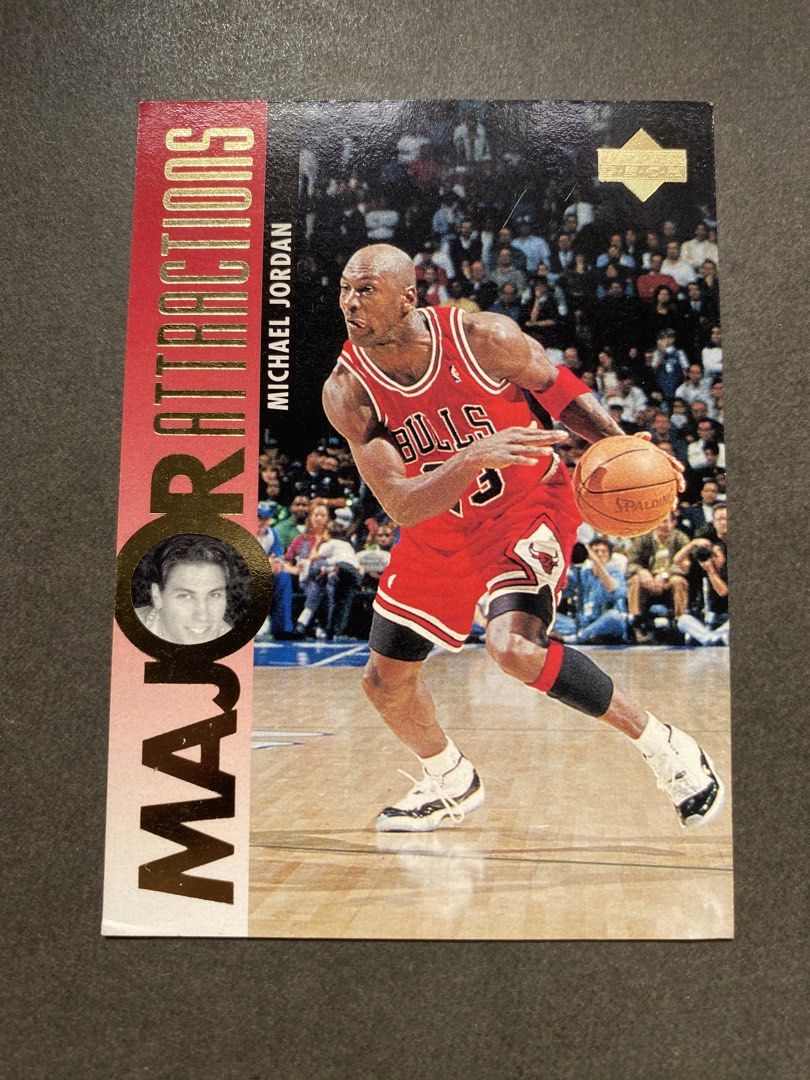 Michael Jordan 337 (Category: Raw Singles) located in Batangas. Submitted by hobbysyo (Listing ID 1470153796, Image 1). Description: - Item: Michael Jordan Upper Deck Major Attractions Basketball Card - Card Number: #337 - Design: Features striking gold foil lettering, a player inset, and the Upper Deck logo - Front: Dynamic action shot of Jordan dribbling in his iconic Chicago Bulls jersey - Back: Includes the official holographic sticker for gu