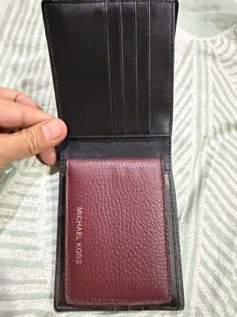 Michael Kors Leather Bifold Wallet Maroon (Category: Wallets & Card Holders) located in Pasig City. Submitted by silentbutterfly (Listing ID 1470344722, Image 2). Description: ‼️Authentic Michael Kors bifold wallet - Premium maroon pebbled leather material - Multiple card slots on the upper section - Includes a removable matching leather card case flap with silver foil embossed logo - Clean interior lining and compact design 📝 Reason for Selling
