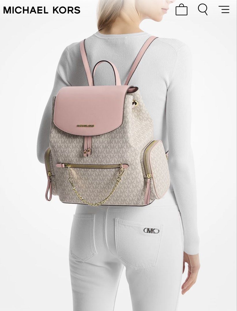 Michael Kors Pink Jet Set Large Logo Backpack (Category: Backpacks) located in Manila. Submitted by jijis_wardrobe (Listing ID 1470277337, Image 2). Description: - 100% Authentic Michael Kors backpack - Signature MK logo print with stylish soft pink leather flap and trim - Elegant gold-tone hardware - Secure drawstring closure with a front flap - Front zip pocket with trendy chain detail - Dual side zip pockets for easy access - Adjustable should