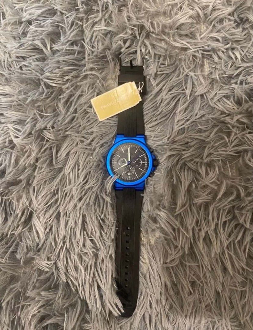 Michael Kors Watch (Category: Men's Watches) located in Cainta. Submitted by vlera (Listing ID 1470298455, Image 3). Description: Selling my Michael Kors oversized blue-tone silicone watch. It’s never been used and is in excellent condition. Details: * Brand: Michael Kors * Style: Oversized watch * Color: Blue tone * Strap: Silicone * Condition: Never used * Packaging: Comes with a replacement watch box, not the original box RFS: Decluttering Shi