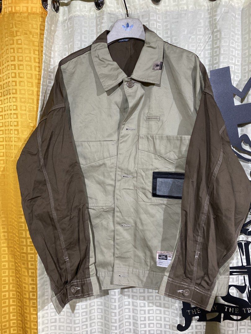 Mihara Yasuhiro Good Inspiration Two-Tone Jacket (Category: Coats, Jackets and Outerwear) located in Caloocan City. Submitted by camarcenin42067 (Listing ID 1470279815, Image 1). Description: - Brand: Mihara Yasuhiro ("Good Inspiration" Collection) - Style: Workwear jacket in khaki body with contrast dark brown long sleeves - Details: Button-up front, multiple utility pockets, and a clear ID slot on the lower front - Accents: Distinctive branded 