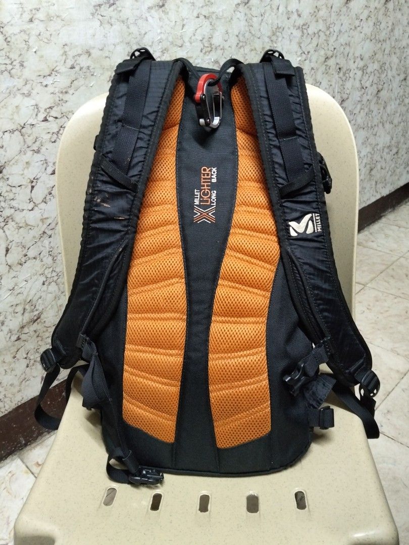 Millet Prolighter 22 Mountaineering Backpack Black Orange (Category: Backpacks) located in Abucay. Submitted by cristineca20489 (Listing ID 1470258989, Image 3). Description: - Brand: Millet Prolighter 22 - Color: Black with bright orange details - Capacity: 22 liters - Weight: Lightweight build at approx. 0.63 kg - Material: Durable ripstop fabric exterior - Features: FPP Ergo ice axe system and hydro system compatible - Interior: Clean with a d
