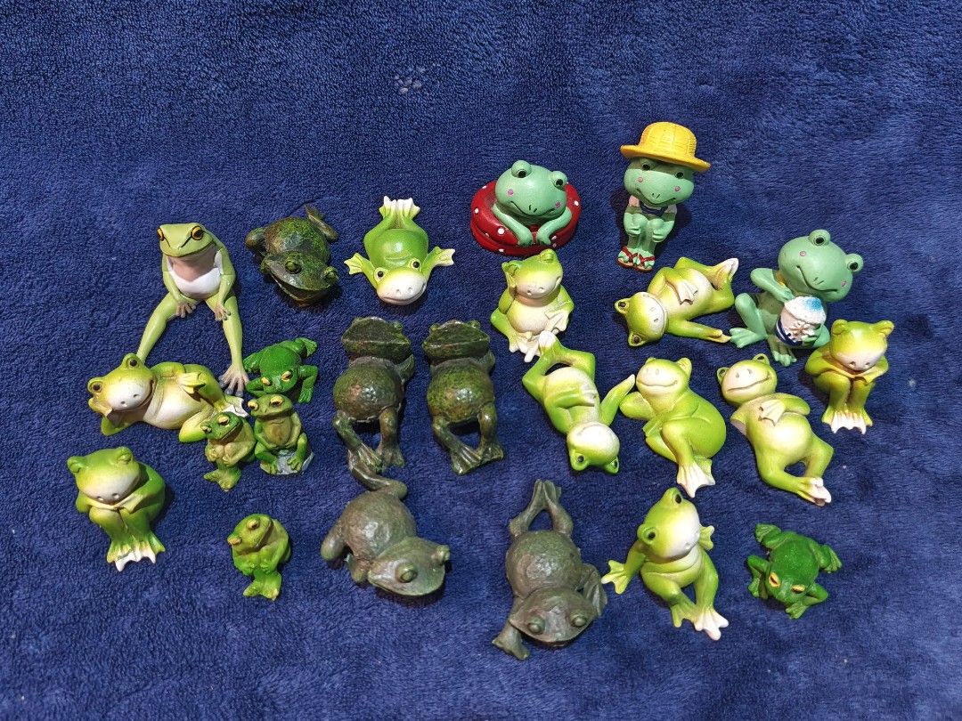 Miniature Green Frog Figurines Set (Category: Figurines & Statues) located in Manila. Submitted by kirstentoyshub (Listing ID 1470246558, Image 1). Description: - 24 PCs Lot of tiny frog figurines in various funny poses - Includes sitting frogs, lounging frogs, frogs in hats, and textured dark green ones - Perfect for fairy gardens, miniature displays, or desktop decor - Features lots of different mixed designs - Selling as a whole set only.