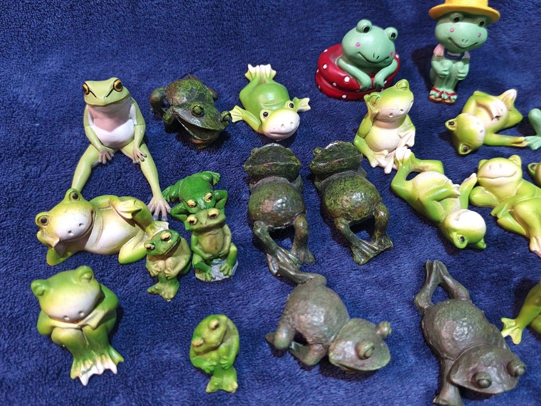 Miniature Green Frog Figurines Set (Category: Figurines & Statues) located in Manila. Submitted by kirstentoyshub (Listing ID 1470246558, Image 2). Description: - 24 PCs Lot of tiny frog figurines in various funny poses - Includes sitting frogs, lounging frogs, frogs in hats, and textured dark green ones - Perfect for fairy gardens, miniature displays, or desktop decor - Features lots of different mixed designs - Selling as a whole set only.