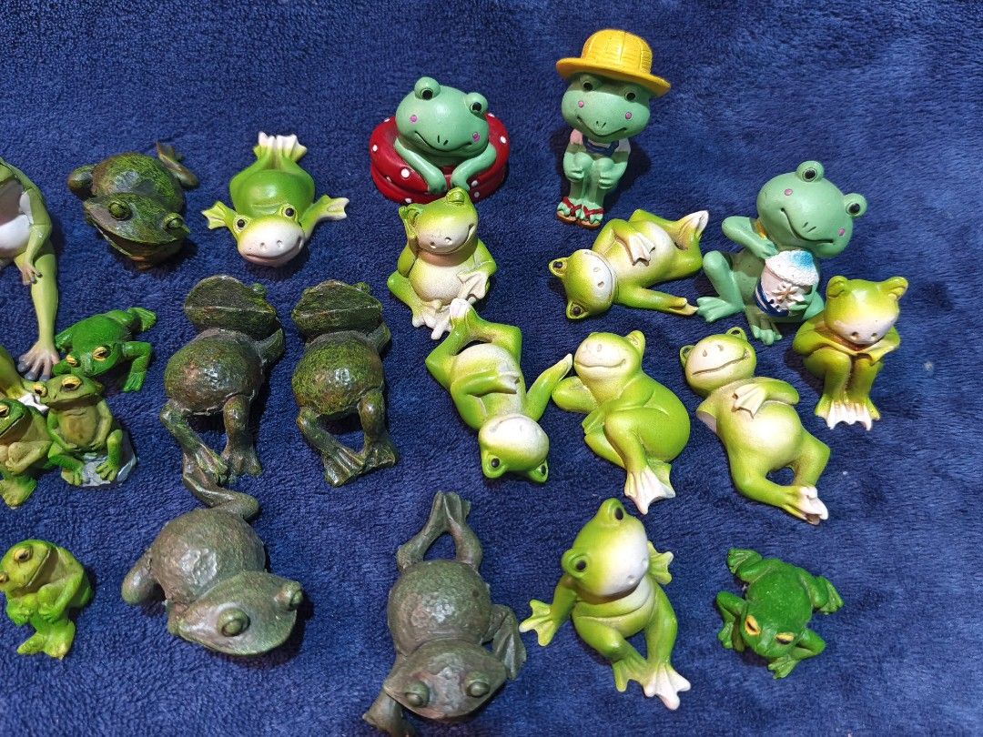 Miniature Green Frog Figurines Set (Category: Figurines & Statues) located in Manila. Submitted by kirstentoyshub (Listing ID 1470246558, Image 3). Description: - 24 PCs Lot of tiny frog figurines in various funny poses - Includes sitting frogs, lounging frogs, frogs in hats, and textured dark green ones - Perfect for fairy gardens, miniature displays, or desktop decor - Features lots of different mixed designs - Selling as a whole set only.