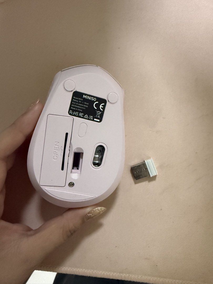 Miniso M516 Wireless Mouse (Category: Mouse & Mousepads) located in Manila. Submitted by elynnethcampo11 (Listing ID 1470268443, Image 2). Description: - Model: Miniso M516 Wireless Mouse - Color: White - Includes USB receiver (as seen in photos) - Features a standard scroll wheel and smooth, clean body design - Battery-operated with an easy-access compartment underneath - Clear branding near the bottom - Perfect and reliable for daily computer t