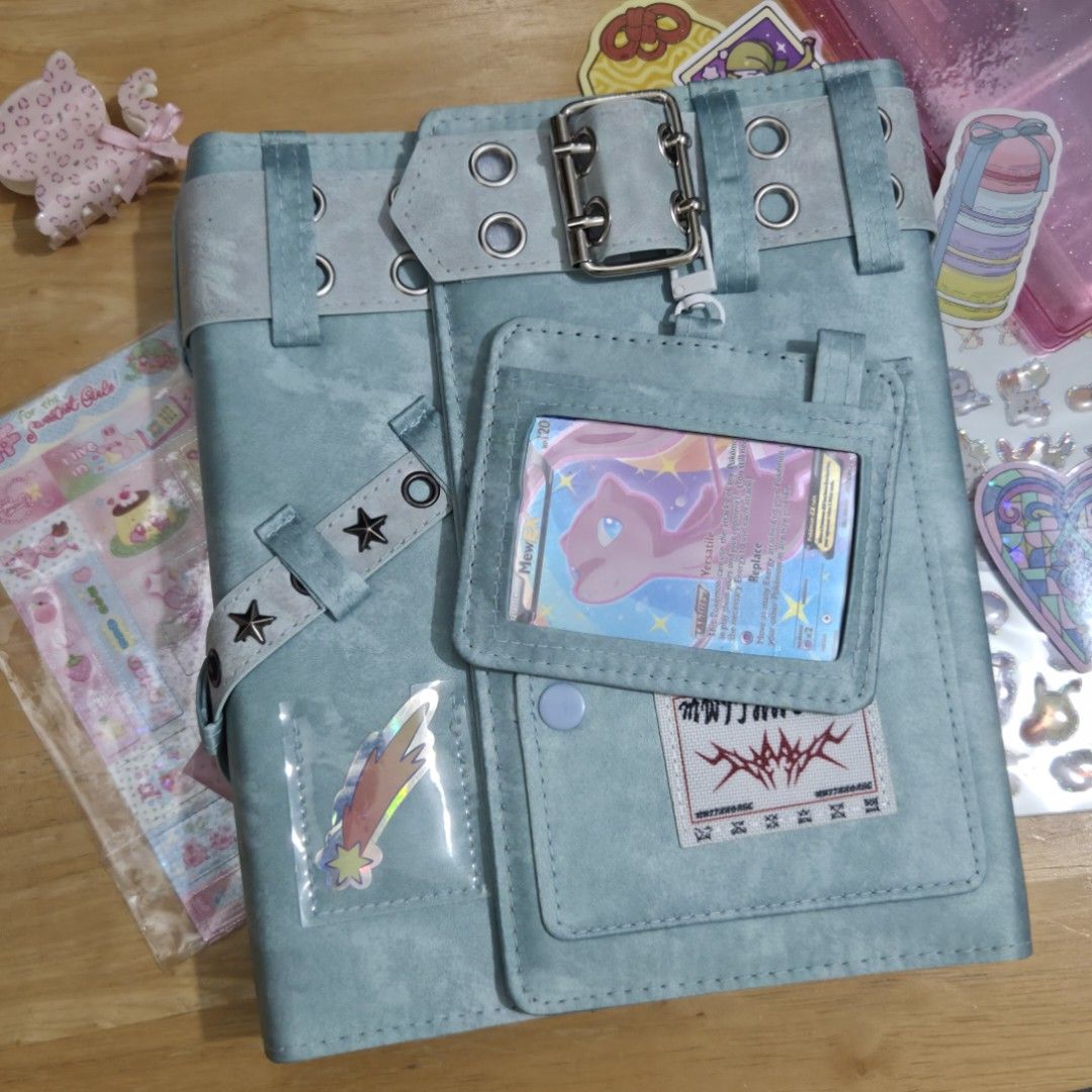 Mint A5 Y2K Binder Photocard Card Journal (Category: Stationery & School Supplies) located in Taguig. Submitted by aeri______99 (Listing ID 1470273983, Image 1). Description: ⋆ A5 Journal ⋆ Includes (20) 4 slot pages. Can fit kpop photocards and pokemon cards (in perfect fit sleeves). ⋆ Stickers and cards are not included but I'll add some freebies ☺️ ⋆ The outer feels like textile ⋆ Also fits A5 journal paper (not included) ⋆ RFS: unused item an