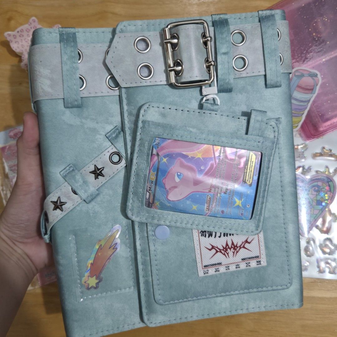 Mint A5 Y2K Binder Photocard Card Journal (Category: Stationery & School Supplies) located in Taguig. Submitted by aeri______99 (Listing ID 1470273983, Image 2). Description: ⋆ A5 Journal ⋆ Includes (20) 4 slot pages. Can fit kpop photocards and pokemon cards (in perfect fit sleeves). ⋆ Stickers and cards are not included but I'll add some freebies ☺️ ⋆ The outer feels like textile ⋆ Also fits A5 journal paper (not included) ⋆ RFS: unused item an