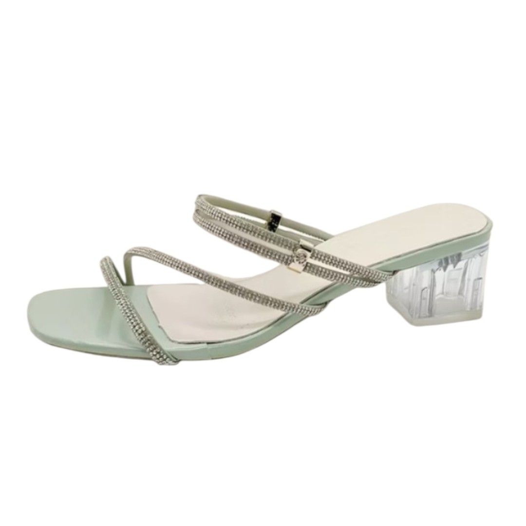 Mint Green Rhinestone Strap Clear Block Heels (Category: Heels) located in Mangaldan. Submitted by closetqwin (Listing ID 1470198225, Image 1). Description: -See 2nd picture for measurements - Color: Mint Green - Style: Slip-on square toe mule heels with clear chunky block heel - Details: Sparkly rhinestone straps across the top - Never been worn -No box - Occasion: Perfect for parties, weddings, or dinners.