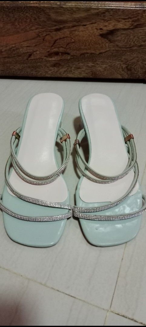 Mint Green Rhinestone Strap Clear Block Heels (Category: Heels) located in Mangaldan. Submitted by closetqwin (Listing ID 1470198225, Image 3). Description: -See 2nd picture for measurements - Color: Mint Green - Style: Slip-on square toe mule heels with clear chunky block heel - Details: Sparkly rhinestone straps across the top - Never been worn -No box - Occasion: Perfect for parties, weddings, or dinners.