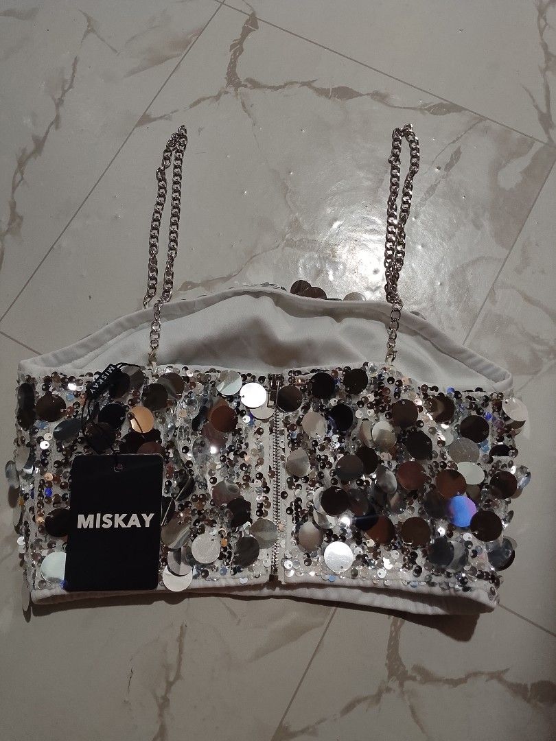 Miskay Silver Sequin Crop Top and Skirt Set (Category: Sets or Coordinates) located in Manila. Submitted by star_closet_ (Listing ID 1470195934, Image 3). Description: - Brand: Miskay (original tag still attached) - Set includes: Matching crop top and skirt - Material: Covered entirely in shiny round silver sequins - Top details: Chic chain straps and exposed back zipper - Occasion: Ideal for parties, nights out, and special events.