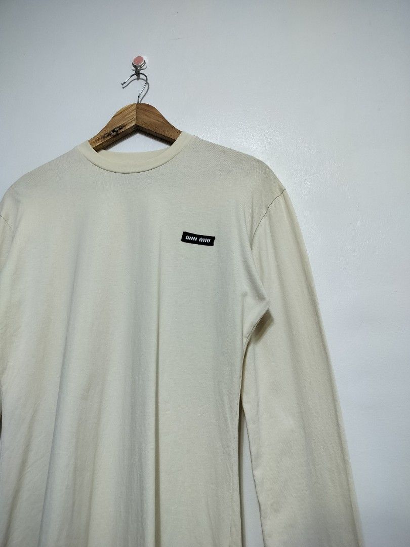Miu Miu Logo Patch Longsleeve (beige) (Category: Longsleeves) located in Taguig. Submitted by thriftybounce (Listing ID 1470246693, Image 2). Description: Fit : S-L Width : 19 Length : 29.5 Color Rate : 9.8/10 Issue : None.