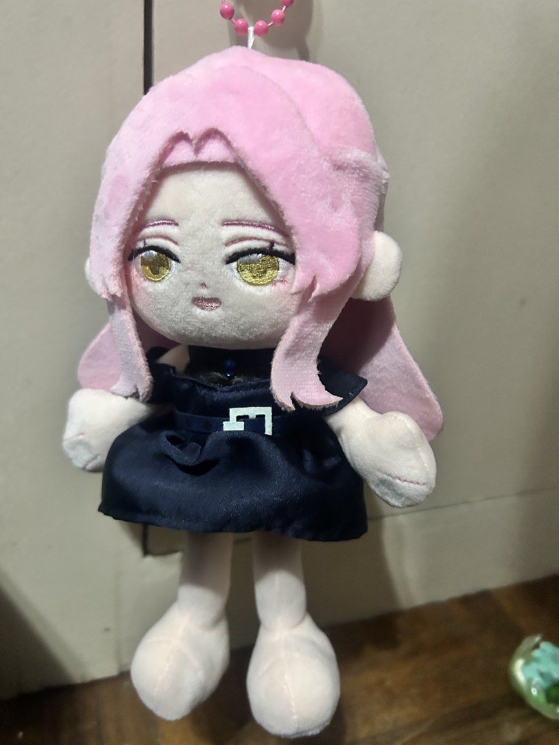 Mizi ChuiChui doll (Category: Plushies & Soft Toys) located in Manila. Submitted by dckardz (Listing ID 1470204108, Image 1). Description: - Adorable anime character plush doll - Features striking pink hair, gold eyes, and embroidered face details - Wears a charming dark blue dress with a white belt buckle - Includes a pink ball chain on top for hanging on bags or keys - Clean and well-maintained condition.