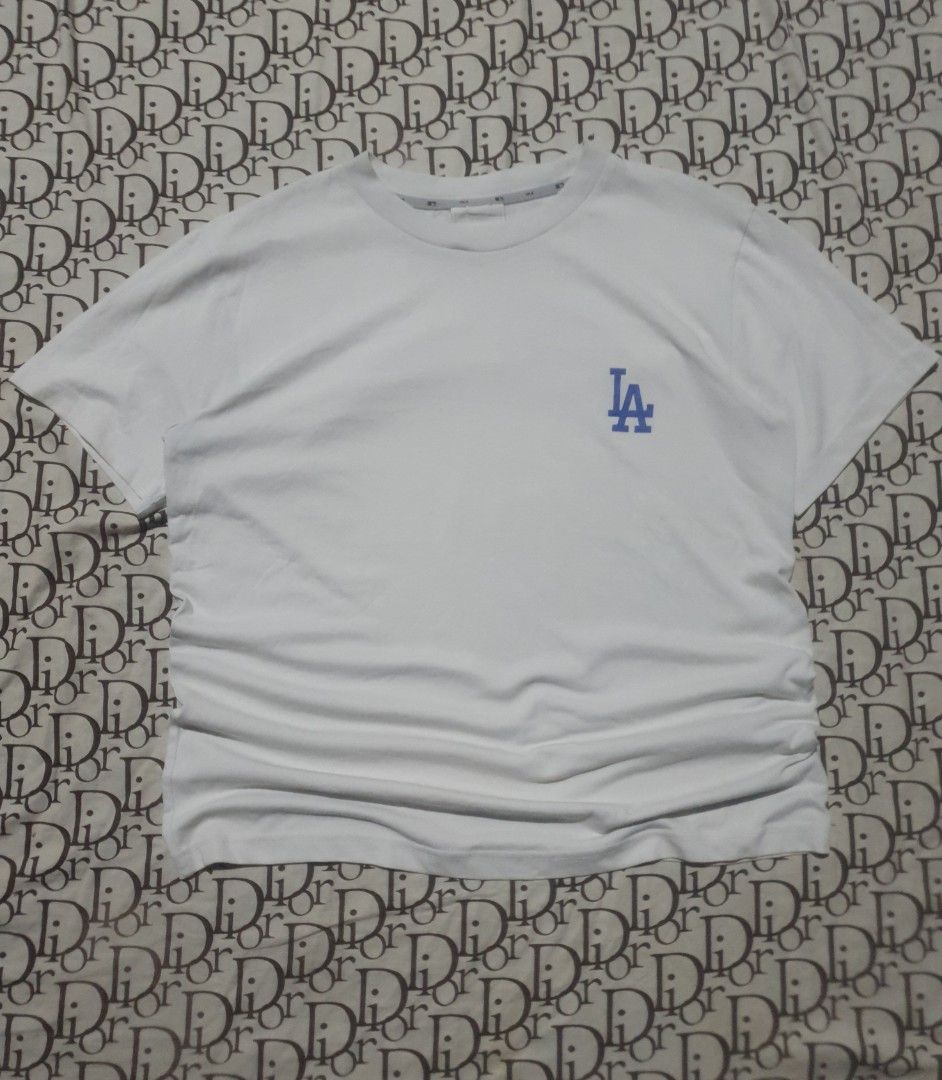 MLB LA dodgers tshirt (Category: Tshirts & Polo Shirts ) located in San Fernando. Submitted by retro.district. (Listing ID 1470347293, Image 1). Description: - MLB LA Dodgers basic logo - Size: Large(22x28) - Condition: Excellent - No issue.