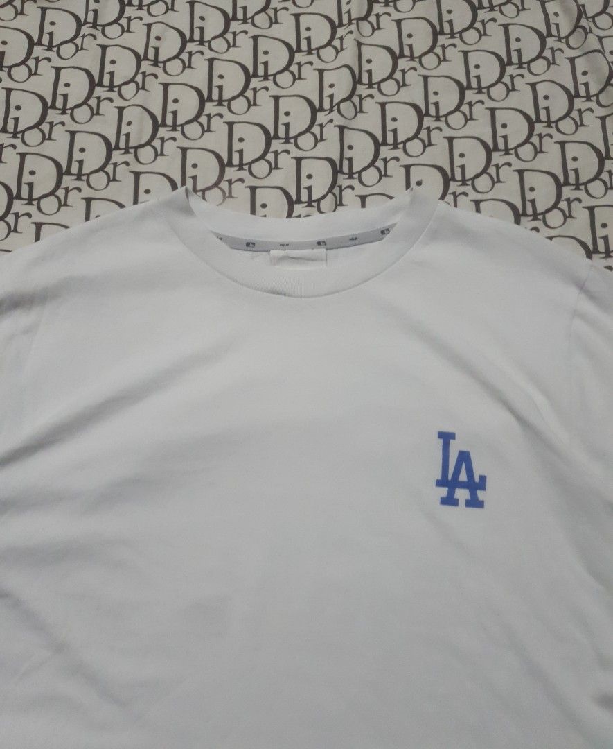 MLB LA dodgers tshirt (Category: Tshirts & Polo Shirts ) located in San Fernando. Submitted by retro.district. (Listing ID 1470347293, Image 2). Description: - MLB LA Dodgers basic logo - Size: Large(22x28) - Condition: Excellent - No issue.