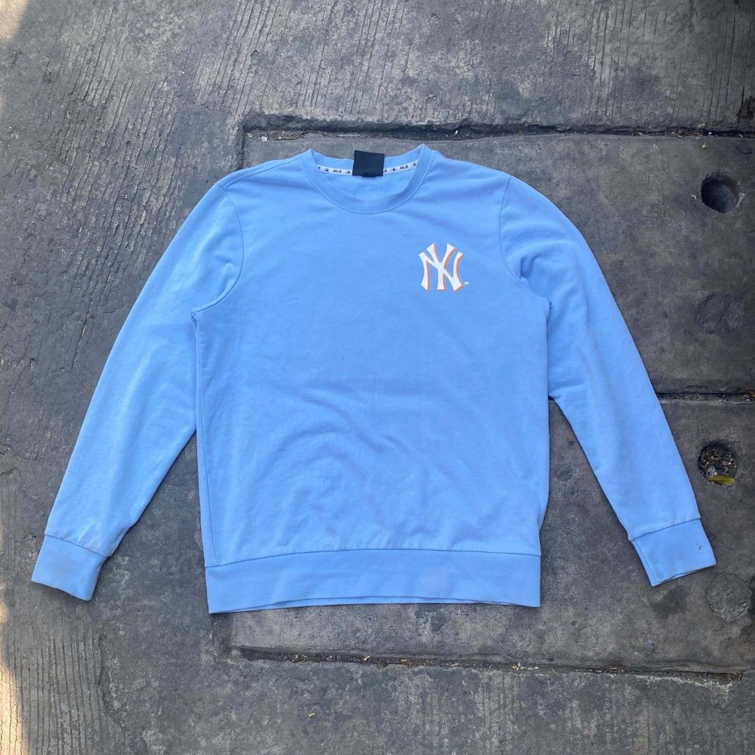 MLB New York Yankees Light Blue Sweatshirt (Category: Coats, Jackets and Outerwear) located in Manila. Submitted by raquimsyt (Listing ID 1470234041, Image 1). Description: - Brand: MLB New York Yankees - Color: Light Blue - Size: Small (Brand new with tags attached) - Design: Small chest and sleeve logos, bold PLAYMLB and #YANKEES back graphic - Comfort: Soft cotton blend with ribbed cuffs and hem.