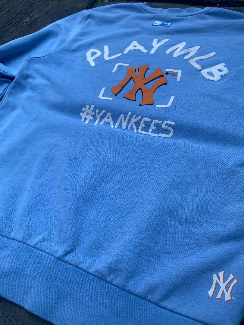 MLB New York Yankees Light Blue Sweatshirt (Category: Coats, Jackets and Outerwear) located in Manila. Submitted by raquimsyt (Listing ID 1470234041, Image 2). Description: - Brand: MLB New York Yankees - Color: Light Blue - Size: Small (Brand new with tags attached) - Design: Small chest and sleeve logos, bold PLAYMLB and #YANKEES back graphic - Comfort: Soft cotton blend with ribbed cuffs and hem.