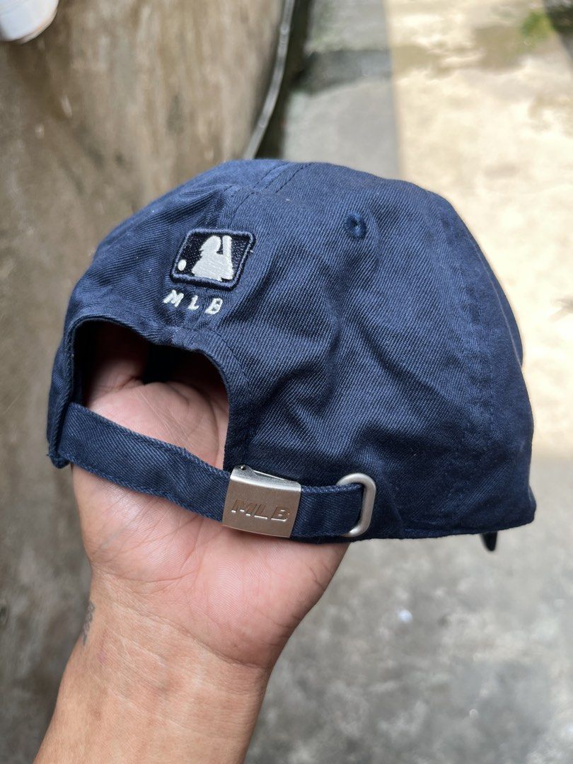 MLB New York Yankees Navy Blue Baseball Cap (Category: Caps & Hats) located in Manila. Submitted by thrifttika (Listing ID 1470225819, Image 3). Description: - Color: Navy Blue - Team: New York Yankees (White embroidered logo) - Style: Classic dad hat - Fit: Adjustable strap with branded metal clasp - Details: Interior branded taping and tags - Condition: Brand new / Excellent.
