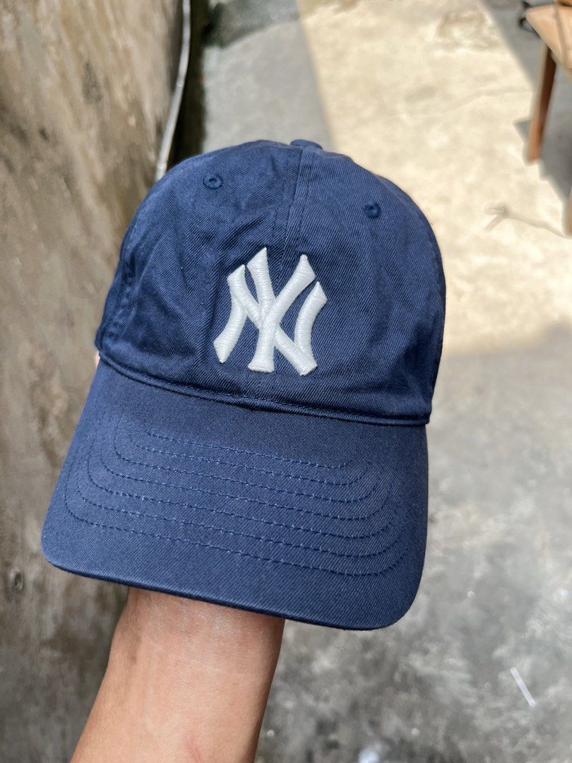 MLB New York Yankees Navy Blue Baseball Cap (Category: Caps & Hats) located in Manila. Submitted by thrifttika (Listing ID 1470225819, Image 2). Description: - Color: Navy Blue - Team: New York Yankees (White embroidered logo) - Style: Classic dad hat - Fit: Adjustable strap with branded metal clasp - Details: Interior branded taping and tags - Condition: Brand new / Excellent.