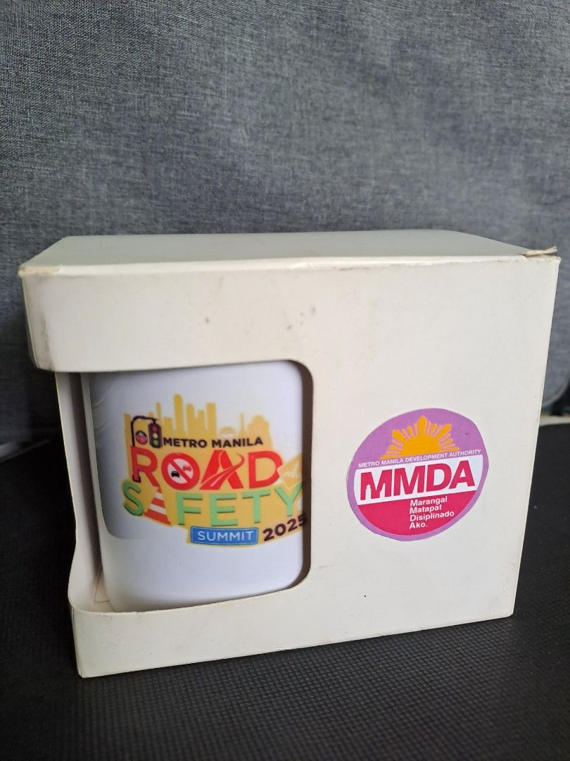 MMDA Mug with Box (Category: Coffee & Tea Tableware) located in Quezon City. Submitted by ph_araoh (Listing ID 1470173397, Image 2). Description: - Official souvenir from the Metro Manila Road Safety Summit 2025 - with MMDA logo - Standard coffee cup size with a smooth glazed ceramic finish - with original box with and sticker * * * * * Courier delivery available P75 shipping within Metro Manila NO COD. Payment first via InstaPay bank transfer Sh