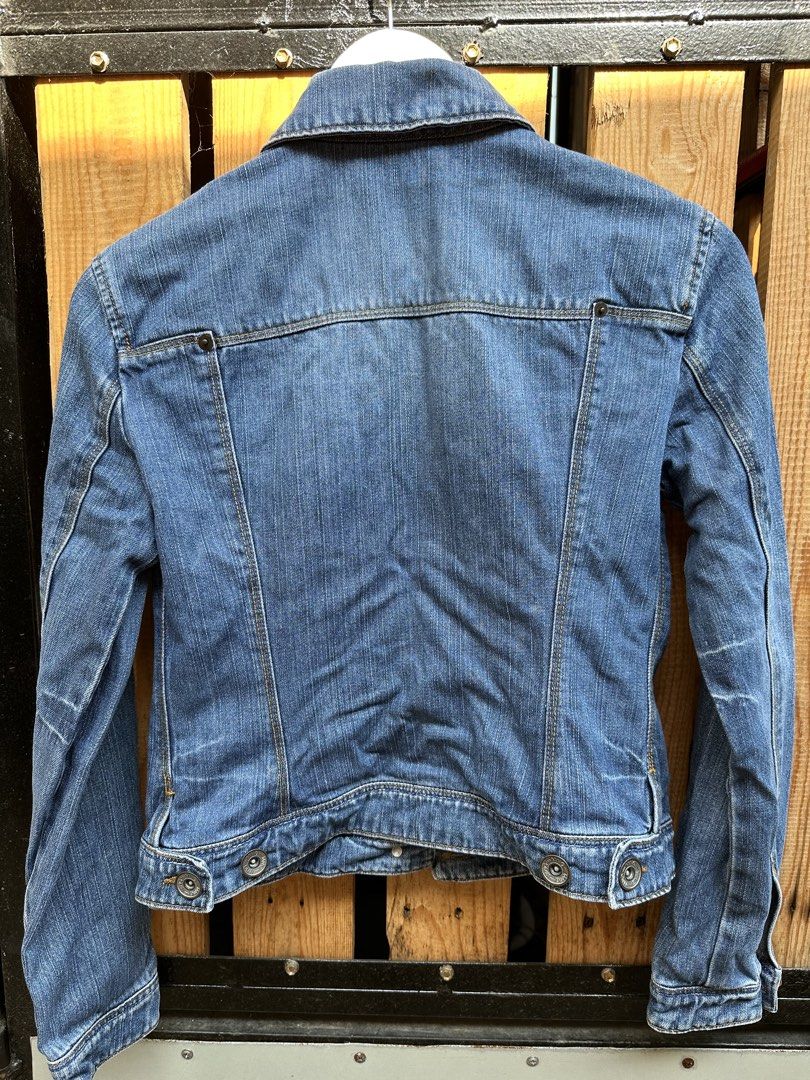 MNG Jeans Blue Denim Jacket Size S (Category: Coats, Jackets and Outerwear) located in Marilao. Submitted by edazh (Listing ID 1470149517, Image 3). Description: - Brand: MNG Jeans - Size: S (fits true to size) - Style: Classic trucker with button closure - Details: Chest flap pockets, contrast stitching, and a bright blue inner lining - Material: Durable cotton denim - Condition: Great for casual everyday layering.