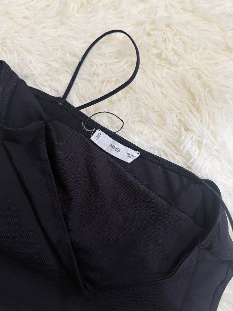 MNG Mango Black Cami Tank Top Size M (Category: Sleeveless) located in Cebu City. Submitted by gdcebu (Listing ID 1470329328, Image 3). Description: - Brand: MNG - Color: Classic Black - Size: M (True to size) - Material & Origin: Made in Turkey - Condition: Clean piece with tag attached - Design: Square neckline with spaghetti straps - Versatile staple for layering or standalone wear.