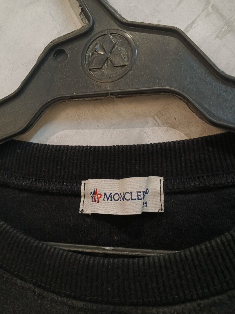 Moncler Embroidered Logo (Category: Coats, Jackets and Outerwear) located in Andop. Submitted by finderskeepersxzz (Listing ID 1470190526, Image 3). Description: S-M womens/ S mens width 20 length 25-26 - Brand: Moncler - Color: Black with large white chest embroidery and logo patch - Material: Heavy cotton, very warm and cozy - Details: Ribbed collar, cuffs, and hem, branded neck tag - Style: Casual streetwear - Note: Pit-to-pit and length measu