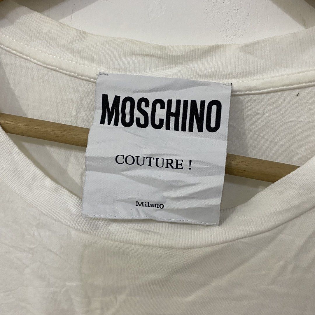 Moschino Unicorn Logo Tshirt (Category: Luxury Apparel) located in Las Pinas. Submitted by declutter_thing69 (Listing ID 1470185882, Image 3). Description: Moschino Unicorn Logo Tshirt Small Good condish width 19 inches length 28 inches shoulder 21 inches sleeve 7.5 inches.