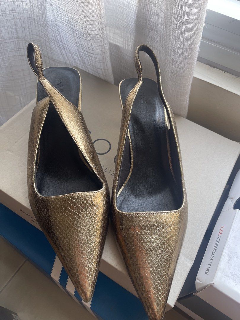 M&S Gold Metallic Pointed Slingback Heels Size 7 (Category: Heels) located in Makati City. Submitted by stephdzn (Listing ID 1470267612, Image 1). Description: - Brand: Marks & Spencer - Style: Pointed toe slingback kitten heels with gold-tone accents - Color/Finish: Metallic gold with a textured snake-effect - Size: UK 7 / EU 40 - Comfort: Built-in Insolia technology for all-day wear - Material: 100% vegan-friendly synthetic materials - Conditio