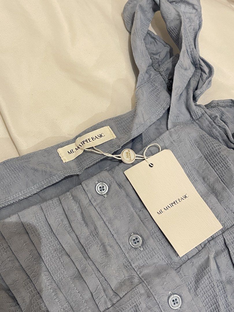 Mt. Matinee Ruffled Top (Category: Sleeveless) located in Quezon City. Submitted by everythingmustgo__ (Listing ID 1470254047, Image 2). Description: Brand new with tags (from BKK) Size: free size Color: powder blue ‼️ firm with price. low ballers will not be entertained ‼️.