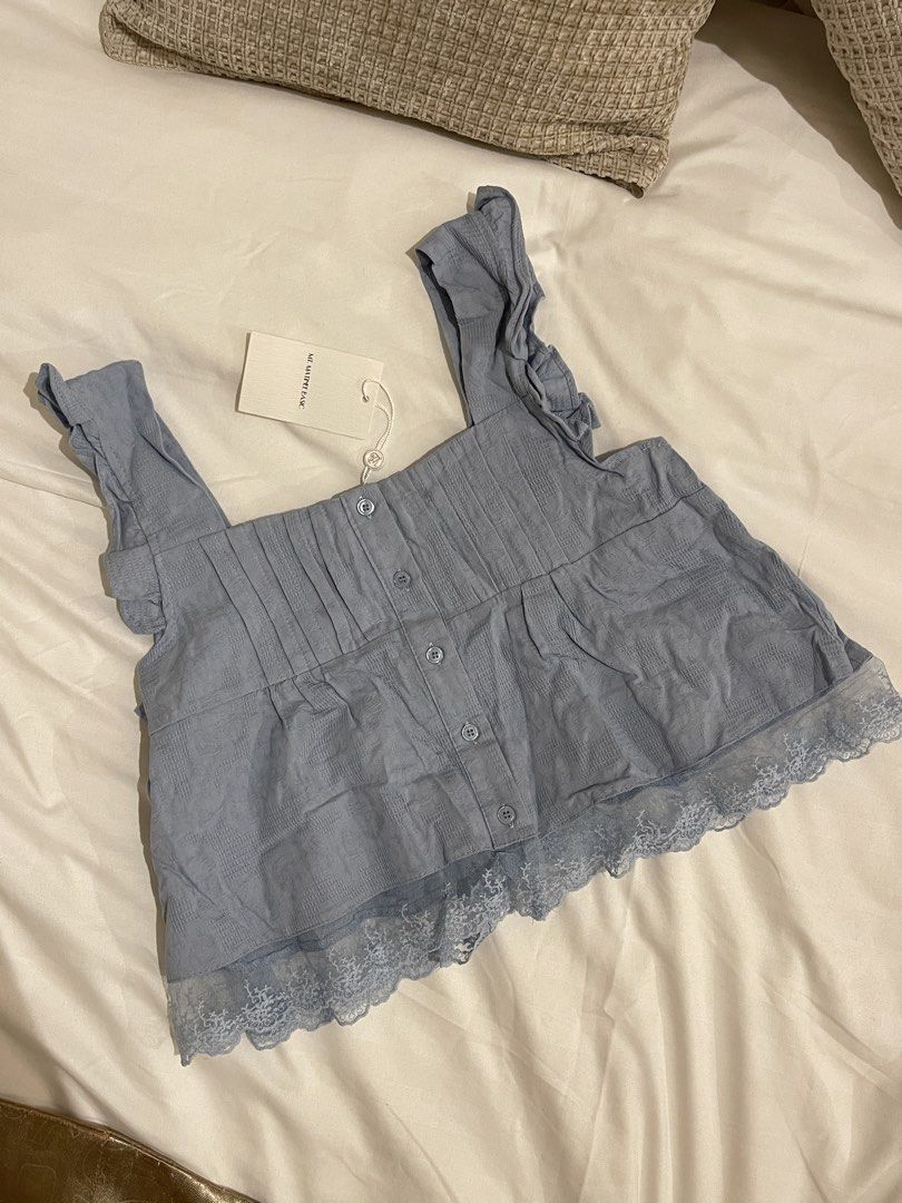 Mt. Matinee Ruffled Top (Category: Sleeveless) located in Quezon City. Submitted by everythingmustgo__ (Listing ID 1470254047, Image 1). Description: Brand new with tags (from BKK) Size: free size Color: powder blue ‼️ firm with price. low ballers will not be entertained ‼️.