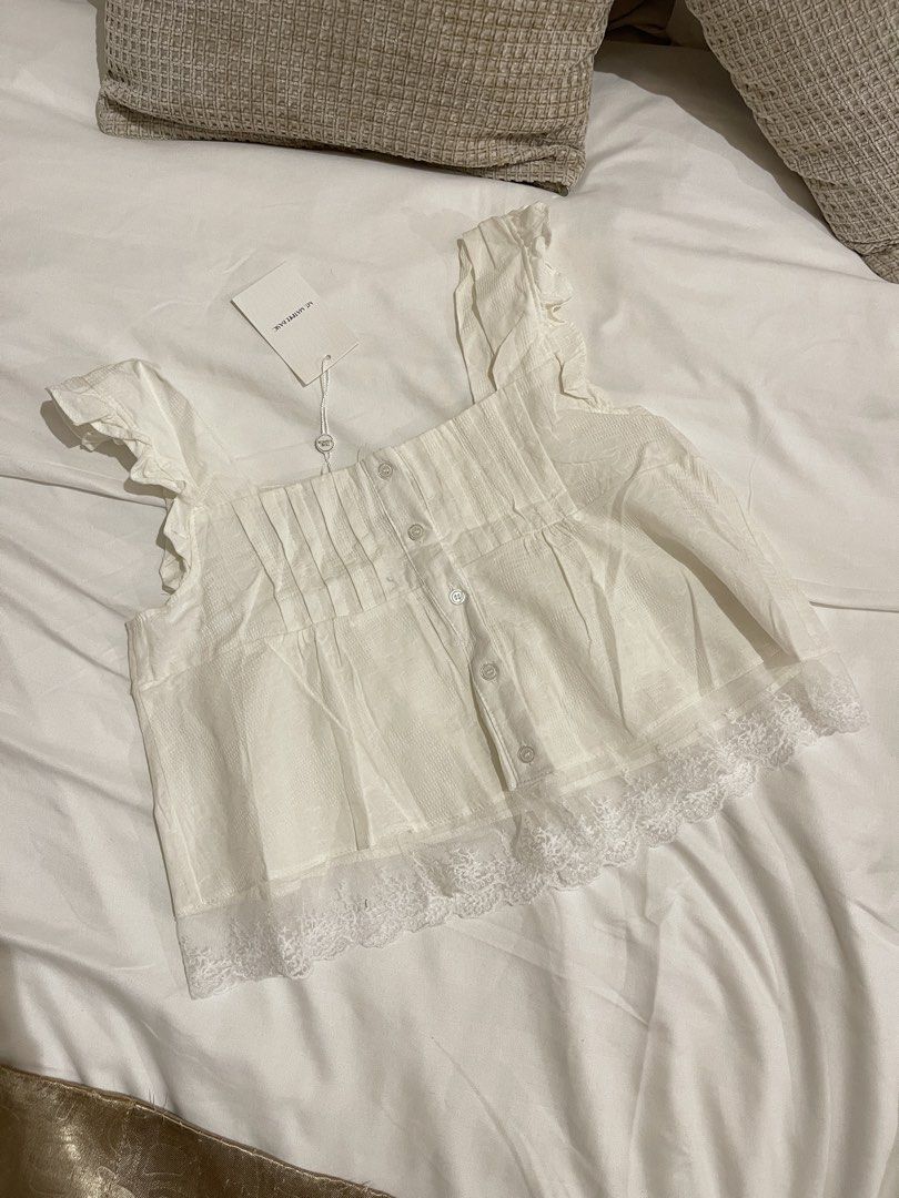 Mt. Matinee Ruffled Top (Category: Sleeveless) located in Quezon City. Submitted by everythingmustgo__ (Listing ID 1470254427, Image 1). Description: Brand new with tags (from BKK) Size: free size Color: white ‼️ firm with price. low ballers will not be entertained ‼️.