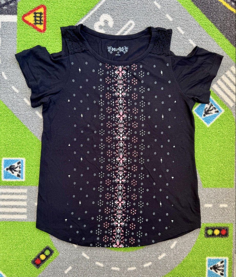 Mudd Black Cold-Shoulder Top Blouse (Category: Babies & Kids Fashion) located in Rizal. Submitted by preloovved (Listing ID 1470213784, Image 1). Description: Chic black Mudd cold-shoulder top in size 10 featuring pretty lace accents, a geometric star print center pattern, and a flattering curved hem. Preloved, 10yo Meet-up only in GB1 San Mateo, Rizal Shipping fee c/o buyer. Tres Marias or J&T express Payment to be sent to me via BPI/BDO/GCASH o