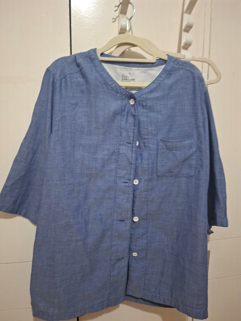 Muji Blue Chambray Button-Up Shirt with Front Pocket (Category: Blouses) located in Paranaque City. Submitted by potatoiceblended (Listing ID 1470179188, Image 1). Description: 22 x 26 inches - Size: XL - Color: Blue chambray - Details: Rounded neckline, half-length sleeves, single chest pocket, white front buttons - Material: Light and very breathable - Condition: Worn a couple of times, retains shape well - Style: Versatile, easy to match with 