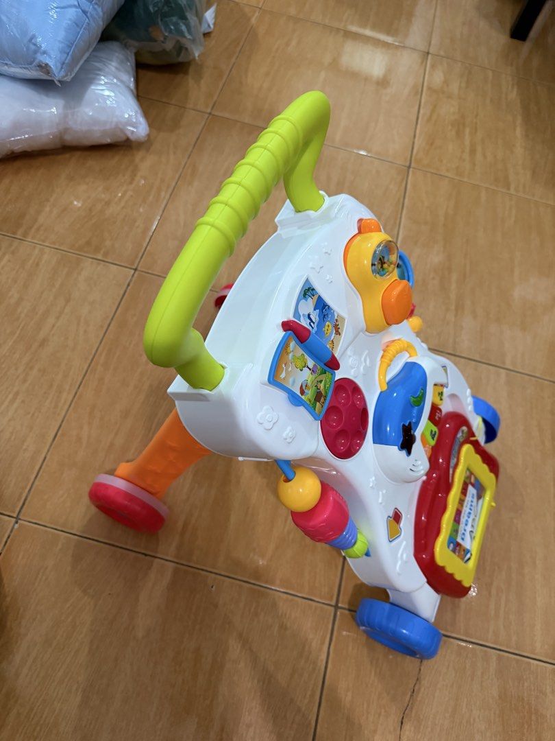 Multi-activity Baby Walker with Learning Board and Toys (Category: Infant Playtime) located in Taguig. Submitted by dvid9 (Listing ID 1470165800, Image 2). Description: - All-in-one baby push walker designed to help toddlers learn to walk safely and with confidence - Packed with interactive toys: mini piano keyboard, spinning gears, telephone rattle, and mini flip book - Built-in magnetic drawing board at the base for extra creative fun - Feature