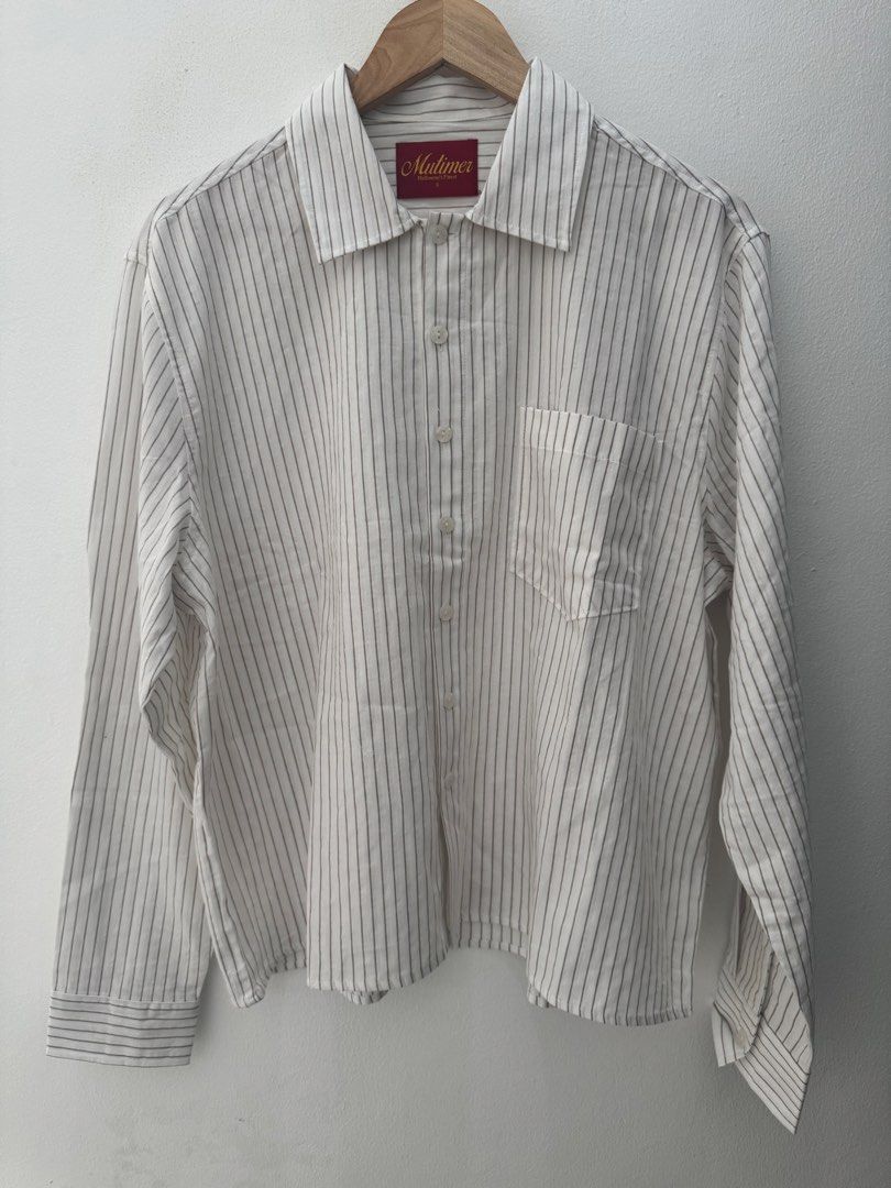 Mutimer Date Night Shirt (Category: Formal Shirts) located in Quezon City. Submitted by youngchow2026 (Listing ID 1470162418, Image 1). Description: 2,500 Size Small (Fits True to size) Condition: 10/10 (Fitted Only) Bought from Mutimer Melbourne Description: - Slightly Cropped, Boxy Fit - 100% Cotton - Light Blue & Brown Pinstripe - Front Chest Pocket RFS: Impulse purchase, ended up not being used. Location: SJDM Bulacan / North Caloocan Message