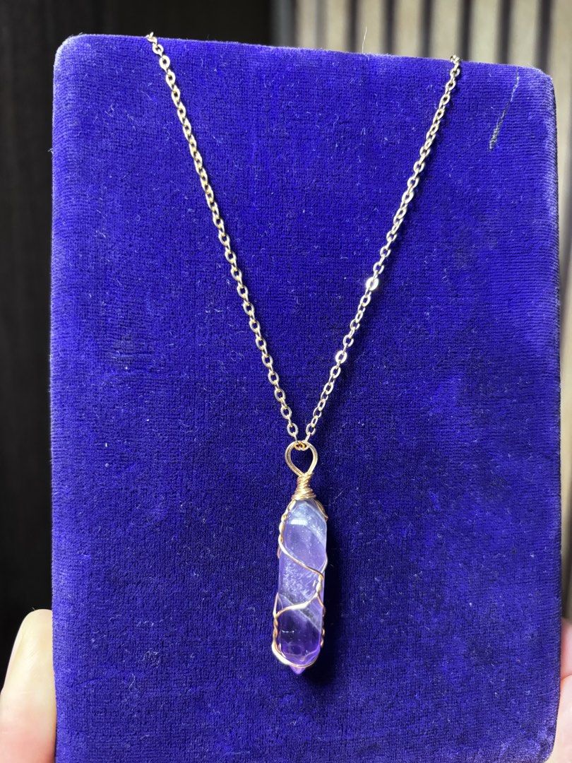 Natural Amethyst Pendant Necklace (Category: Necklaces) located in Caloocan City. Submitted by berndale_closet (Listing ID 1470170889, Image 2). Description: - Natural Amethyst crystal point pendant with unique natural variations - Elegant gold wire wrapping - Includes a matching gold-tone chain necklace, 18" - Clean metal link chain with a secure clasp - Versatile, easy-to-match everyday jewelry piece Japan sources.