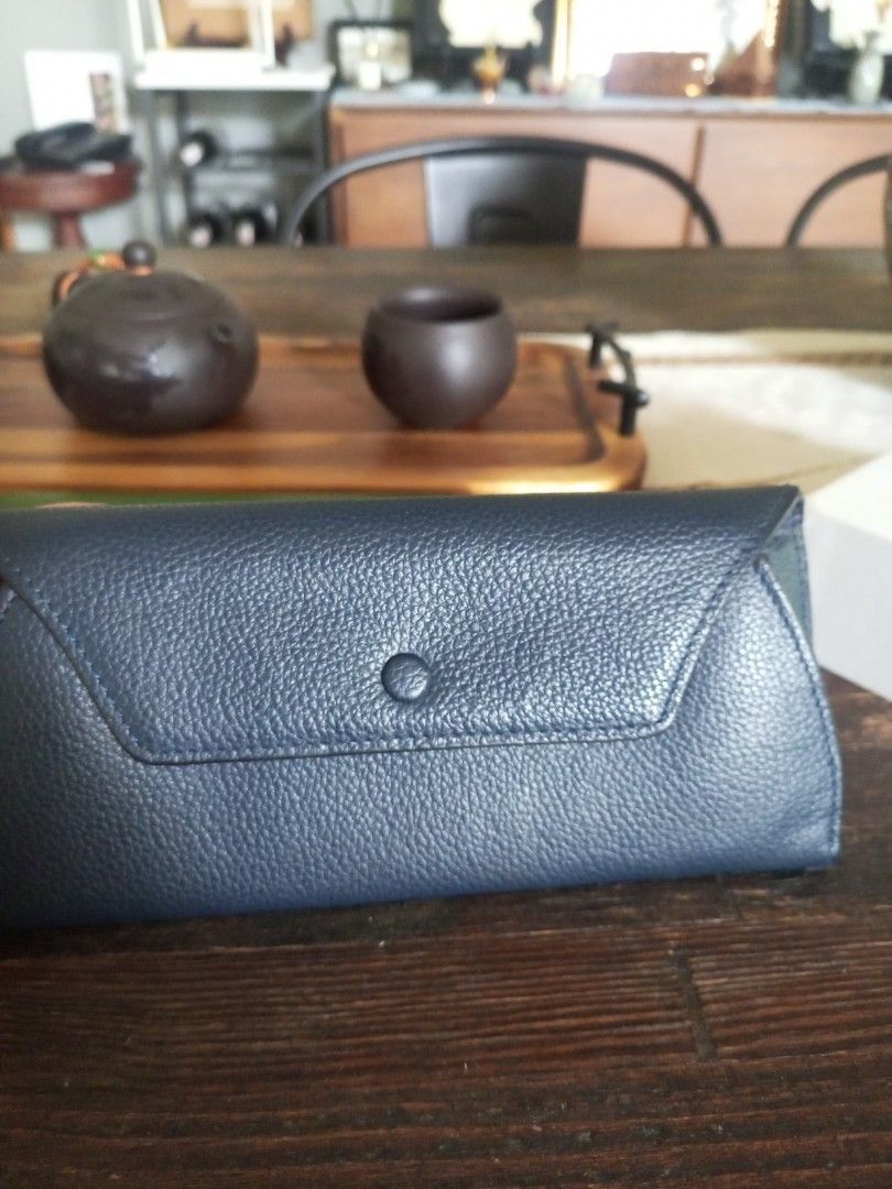 Navy Blue Leather Glasses Case (Category: Wallets & Card holders) located in Paranaque City. Submitted by thisyear30 (Listing ID 1470203507, Image 1). Description: - Color & Material: Dark blue leather with a stylish pebble texture - Closure: Secure snap button flap - Protection: Soft interior lining prevents scratches - Sized to fit most standard sunglasses and reading glasses - Condition: Clean inside and out, ready for use - price negotiable .