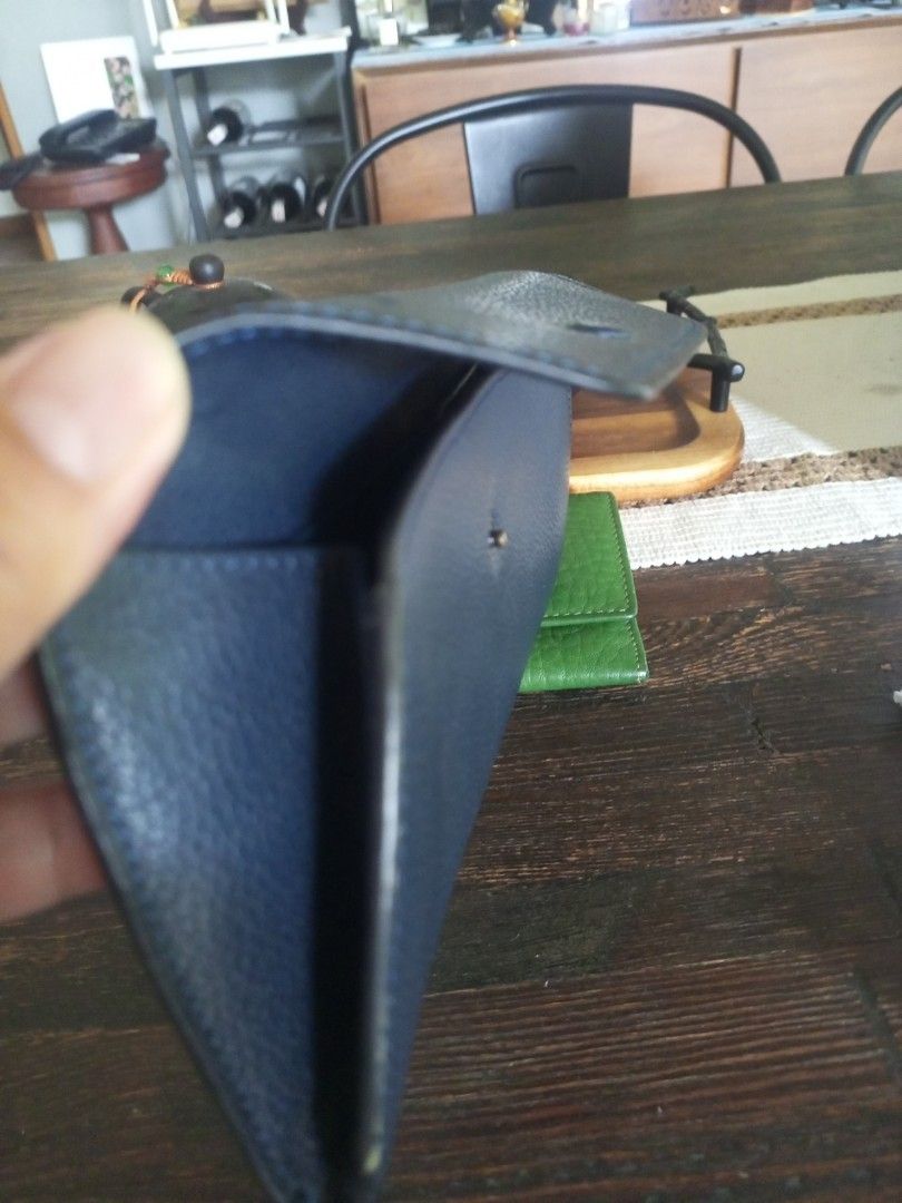 Navy Blue Leather Glasses Case (Category: Wallets & Card holders) located in Paranaque City. Submitted by thisyear30 (Listing ID 1470203507, Image 3). Description: - Color & Material: Dark blue leather with a stylish pebble texture - Closure: Secure snap button flap - Protection: Soft interior lining prevents scratches - Sized to fit most standard sunglasses and reading glasses - Condition: Clean inside and out, ready for use - price negotiable .