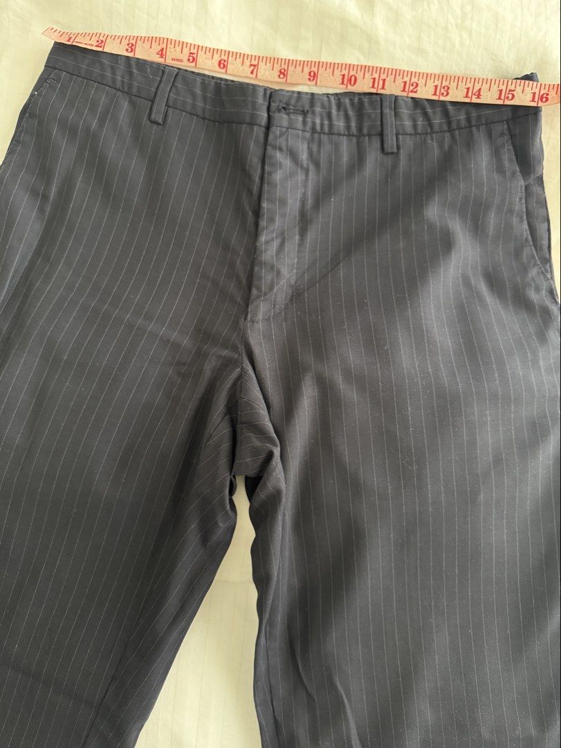 Navy Pinstripe Mid waist Trousers (Category: Other Bottoms) located in Manila. Submitted by ramoneybaloney (Listing ID 1470193608, Image 2). Description: Measurements: Waist - 32” Rise - 10” Thigh - 22” Hips - 40” Has rips on the pockets but sewed them up, doesn’t affect function and not obvious when worn.