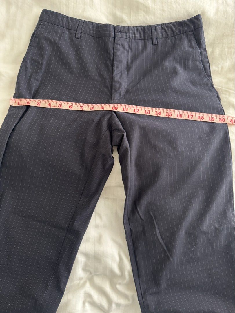 Navy Pinstripe Mid waist Trousers (Category: Other Bottoms) located in Manila. Submitted by ramoneybaloney (Listing ID 1470193608, Image 3). Description: Measurements: Waist - 32” Rise - 10” Thigh - 22” Hips - 40” Has rips on the pockets but sewed them up, doesn’t affect function and not obvious when worn.