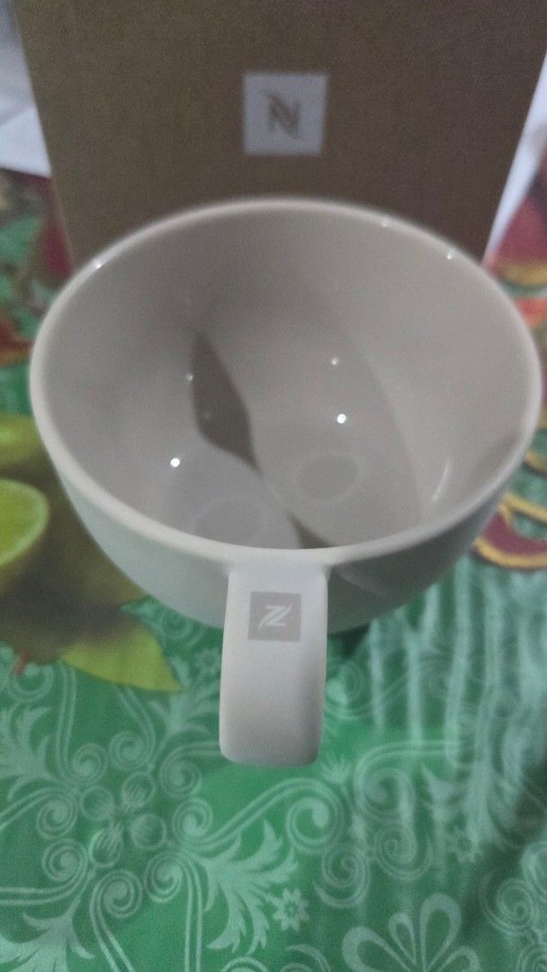 Nespresso Barista Cappuccino Medium Cup (Category: Coffee & Tea Tableware) located in Quezon City. Submitted by liquidatormnl (Listing ID 1470268349, Image 3). Description: - Brand: Nespresso Barista - Item: Medium cappuccino cup - Material: Porcelain - Color: Neutral off-white with logo on handle - Condition: Brand new, never used, stored properly - Inclusions: Original brown cardboard box - Perfect addition to your daily coffee setup.