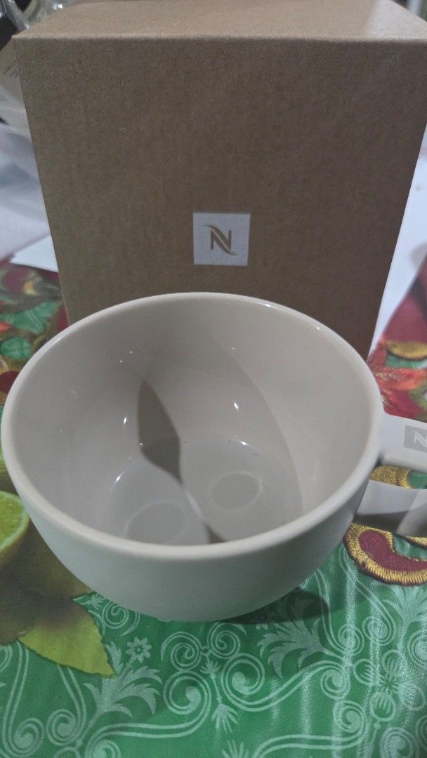 Nespresso Barista Cappuccino Medium Cup (Category: Coffee & Tea Tableware) located in Quezon City. Submitted by liquidatormnl (Listing ID 1470268349, Image 1). Description: - Brand: Nespresso Barista - Item: Medium cappuccino cup - Material: Porcelain - Color: Neutral off-white with logo on handle - Condition: Brand new, never used, stored properly - Inclusions: Original brown cardboard box - Perfect addition to your daily coffee setup.